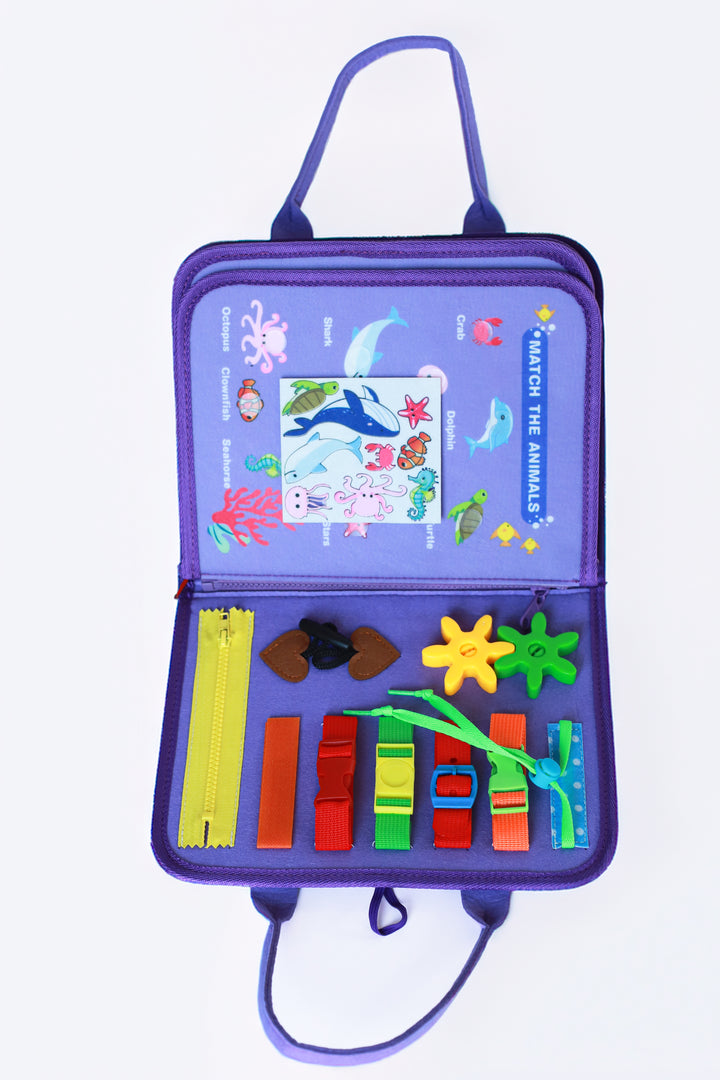 Kelioninė/lavinamoji Montessori užimtumo knygelė "Purple mermaids"