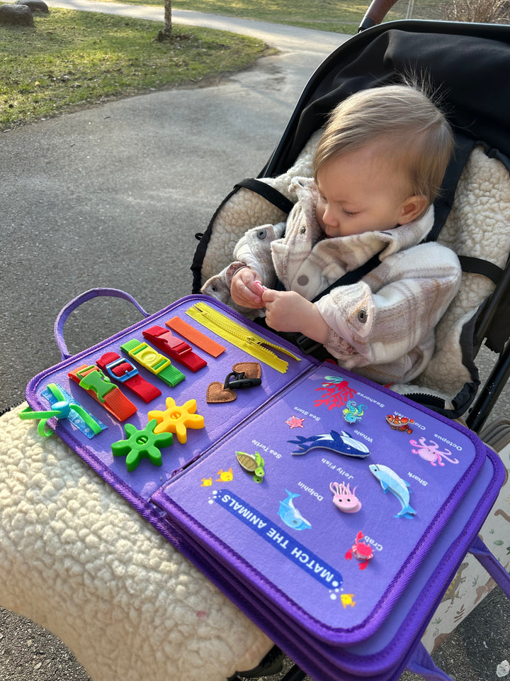 Kelioninė/lavinamoji Montessori užimtumo knygelė "Purple mermaids"